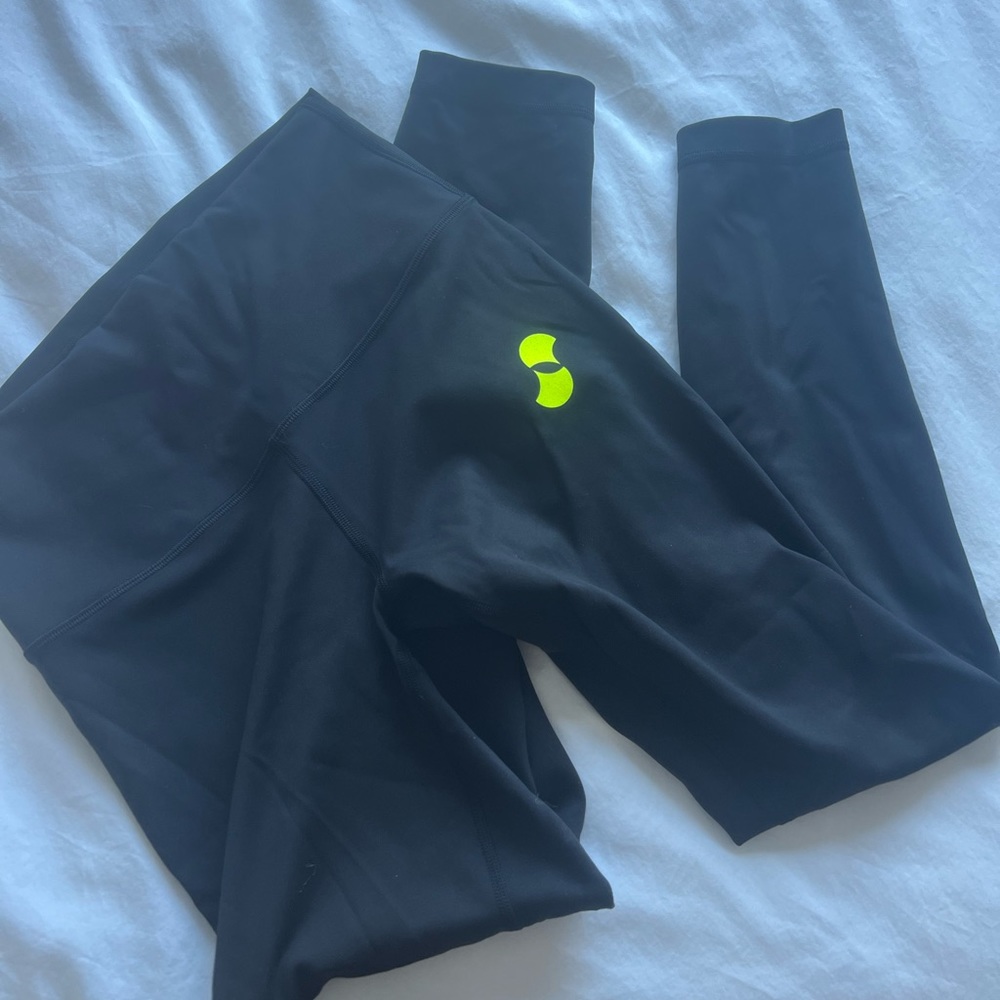Lululemon leggings with Supernatural logo